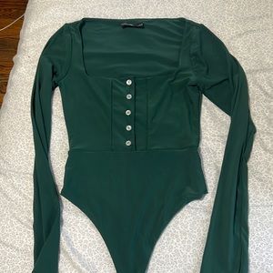 Lightly worn, green bodysuit